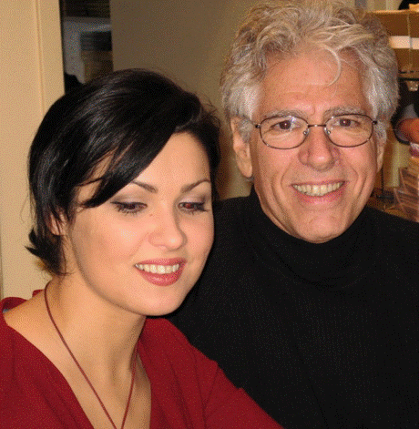 A couple of people posing for the camera

Description automatically generated