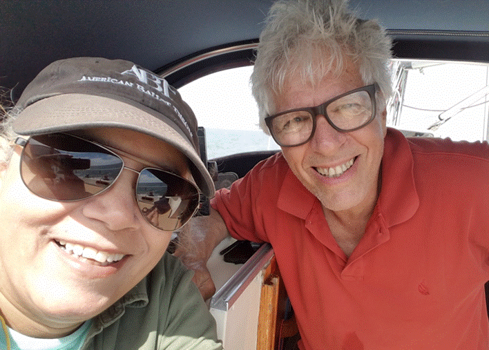 A couple of people posing for the camera

Description automatically generated