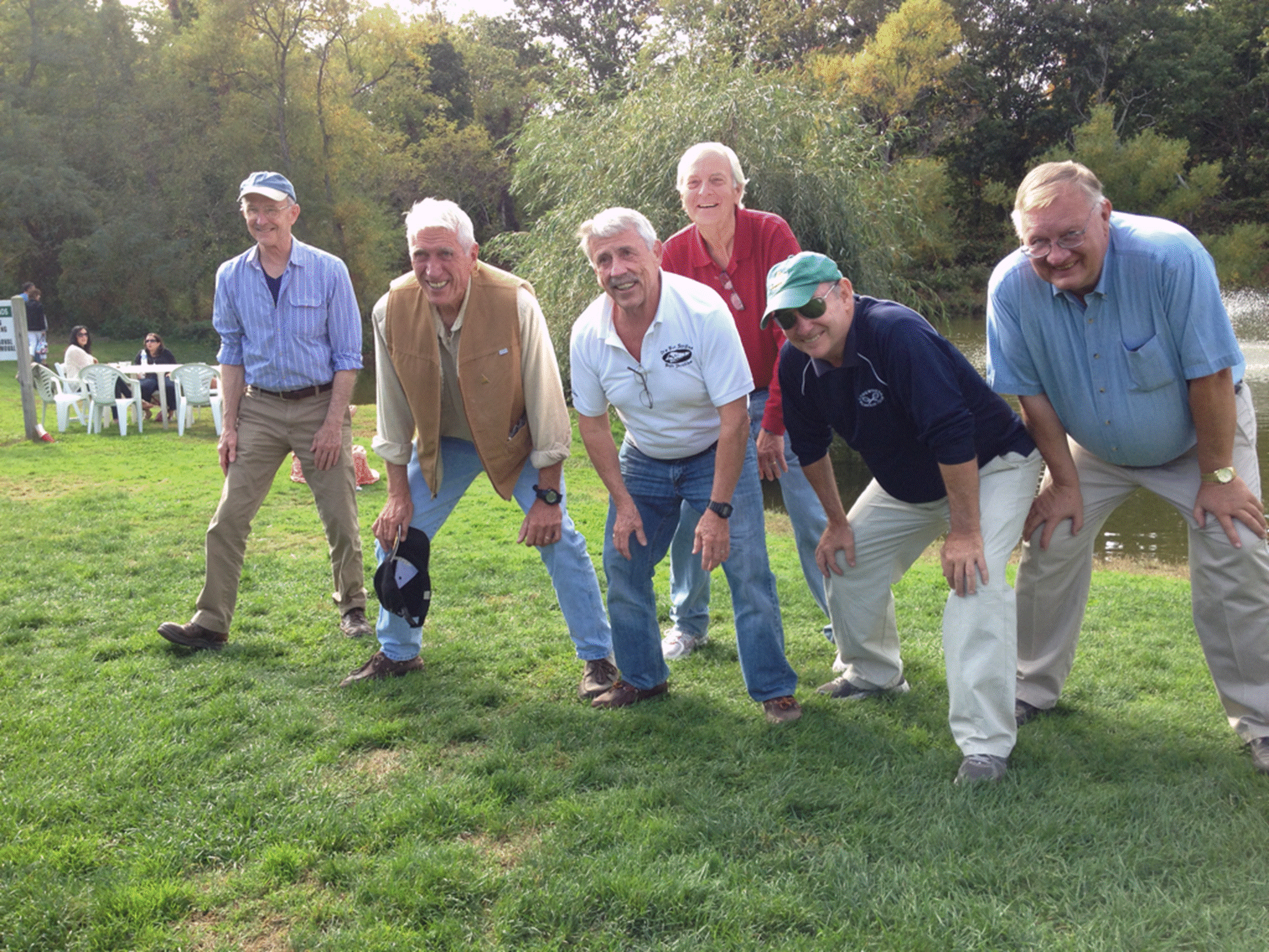 A group of men in a field

Description automatically generated with low confidence