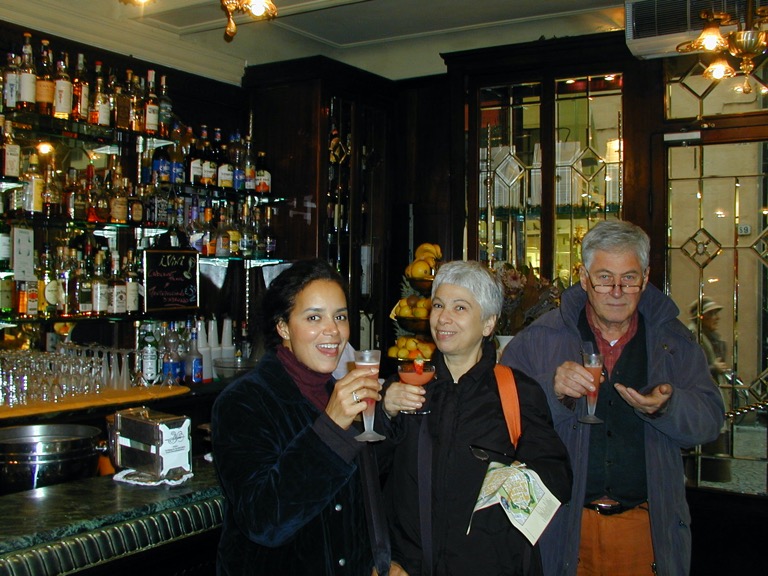 A group of people standing in a bar

Description automatically generated with low confidence