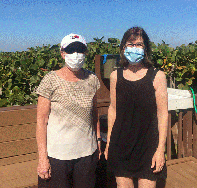 Two people wearing face masks

Description automatically generated with low confidence