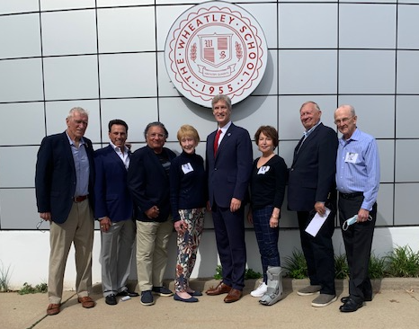 A group of people posing for a photo

Description automatically generated