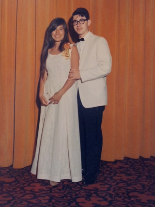 A person and person posing for a picture

Description automatically generated