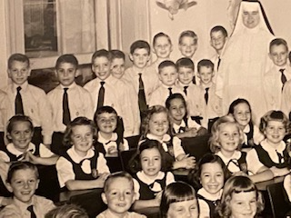 A group of people posing for a photo

Description automatically generated