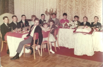 A group of people sitting around a table

Description automatically generated