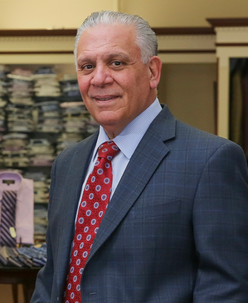 A person in a suit and tie

Description automatically generated with medium confidence