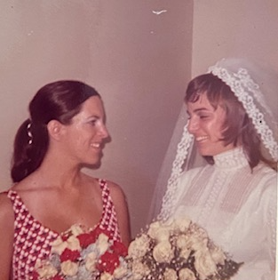 A person holding a bouquet of flowers

Description automatically generated with low confidence